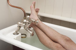 6887   Man enjoying a hot relaxing bath