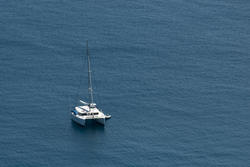 6317   Luxury catamaran moored offshore