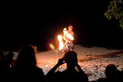 6330   Tourists watching Fijian fire dancers