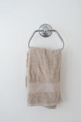 6923   Beige hand towel hanging in a bathroom