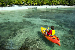 6300   Kayaker on crystal clear tropical water