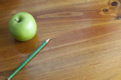 7024   School desk with pencil and apple