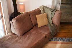 8831   Comfortable couch with a woollen throw