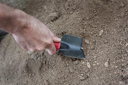 9843   Man digging in the garden with a trowel