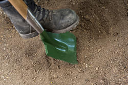 9844   Garden spade alongside old boots
