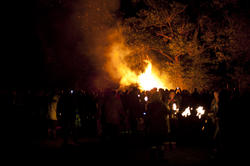 8885   Crowd watching a roaring bonfire on Guy Fawkes