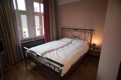 8935   Large bedroom with a wrought iron bed