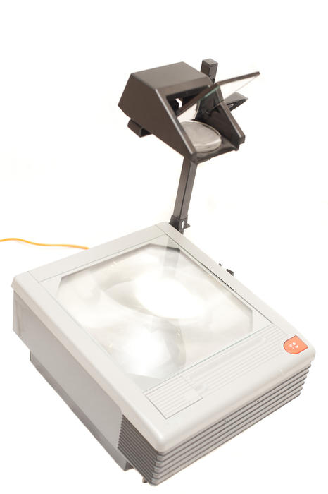 Close up Overhead Projector Device Technology for Presentations Using Printed Acetates Isolated on White Background.