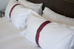 8928   White pillows with decorative bands