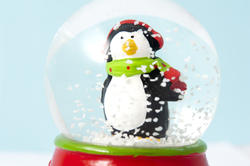 8636   Cute little penguin in a shaken snow globe