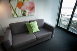 8839   Grey sofa in a small urban apartment