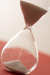 12949   Hourglass with sand pouring close up