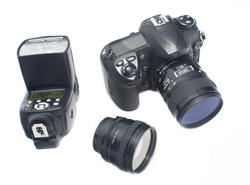 12191   Digital camera, lens and flash strobe