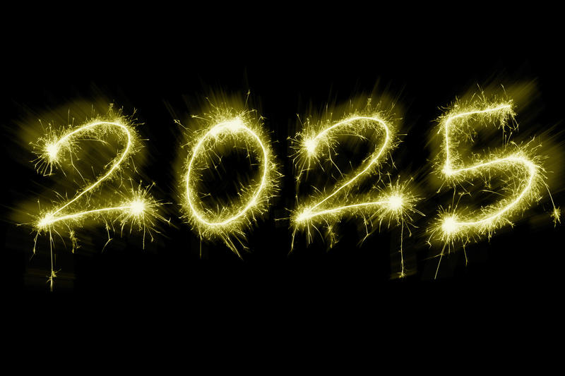 Zooming golden sparkling fireworks as Happy new year holiday 2025 over black background