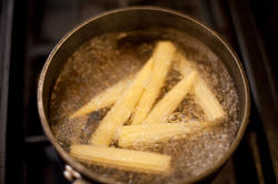 10500   Baby sweetcorn boiling in a pot