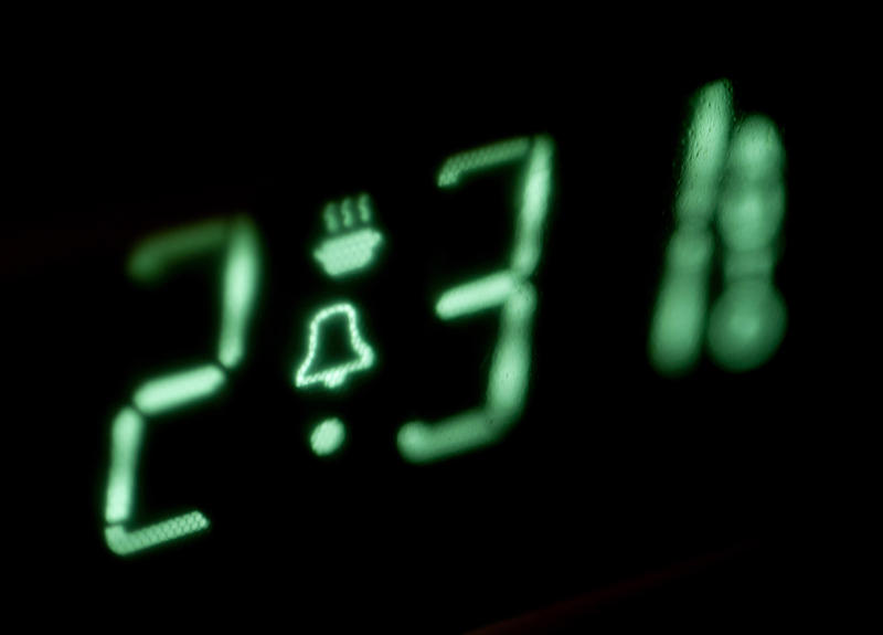 Electronic display of the timer of a microwave oven with countdown and alarm set