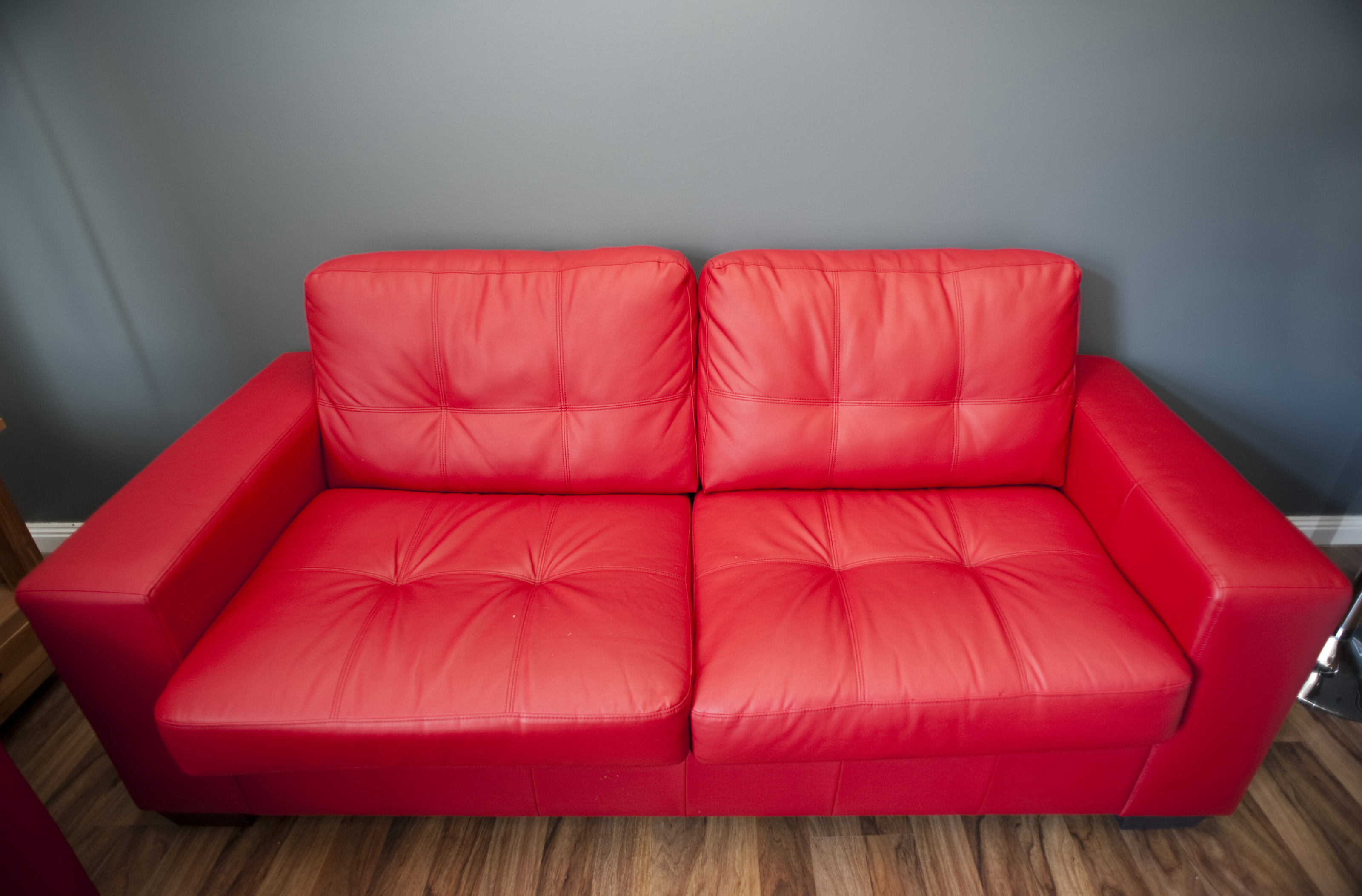 leather sofa with high legs